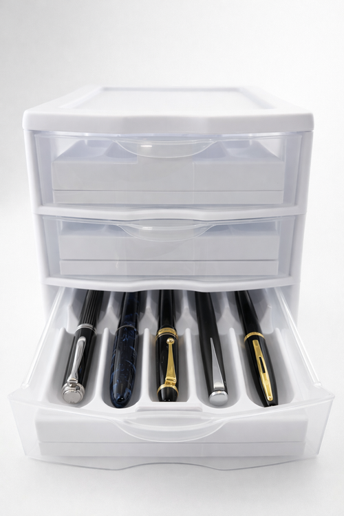Set of fountain pens in a clear plastic case on a white background